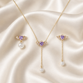 Winged Purple Asymmetric Necklace Earrings Set