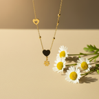 Black Enamel Heart Daisy Flower Drop Necklace close up by SVORA