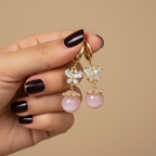 Pink Pearl Butterfly Dangler Earrings in hand by SVORA
