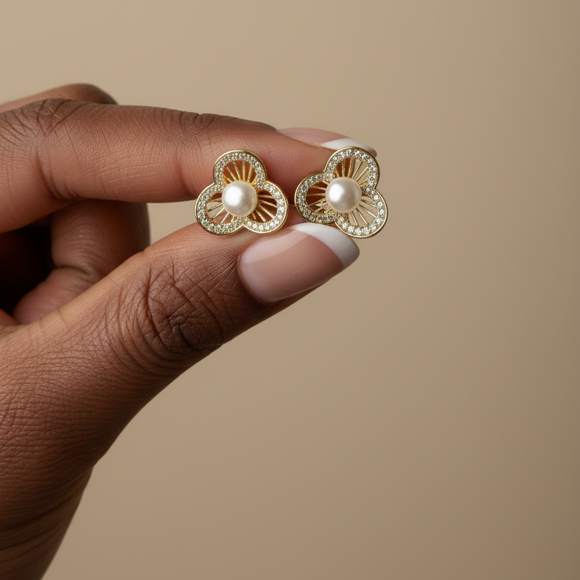 Pearl and Flower Stud Earrings in hand by SVORA