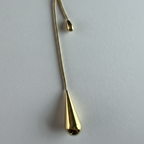 Golden Tear Drop Lariat Necklace close up by SVORA