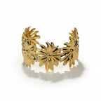 SVORA Marigold Bloom Cuff Bracelet, 18K gold plated stainless steel with five oversized floral blooms. Adjustable.