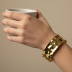 SVORA wide hammered gold cuff bracelet made of 18K gold plated stainless steel, adjustable and waterproof.