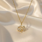 SVORA gold Tree of Life necklace with white CZ stones on a delicate chain. 18K gold plated stainless steel.