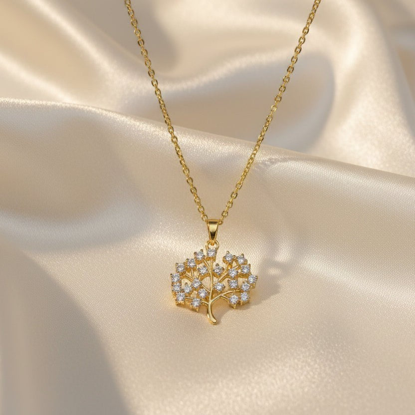SVORA gold Tree of Life necklace with white CZ stones on a delicate chain. 18K gold plated stainless steel.