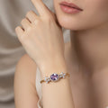 SVORA Amethyst Oval Layered Bracelet with CZ halo and floral accents on a rose gold chain. Waterproof, anti-tarnish.