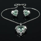 SVORA aqua heart necklace and earrings set with pave wings and crown detail. Silver-tone.