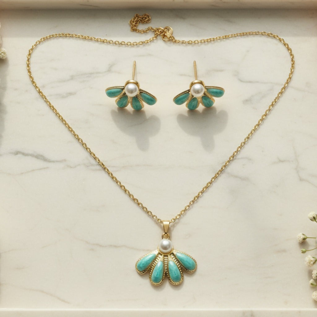 SVORA gold-tone necklace and earrings set with sea-green enamel fan pendants and pearl accents.