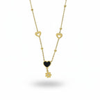 SVORA gold necklace with black enamel heart, daisy charm, and hollow heart accents. Stainless steel, 18k gold plated.