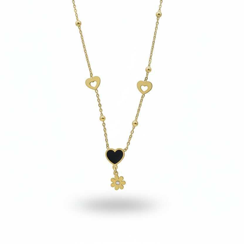 SVORA gold necklace with black enamel heart, daisy charm, and hollow heart accents. Stainless steel, 18k gold plated.