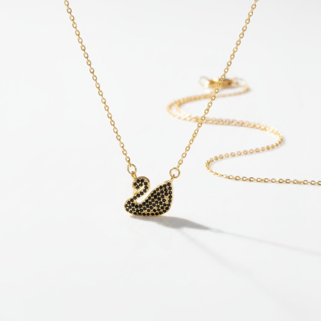SVORA gold plated stainless steel necklace with a black swan pendant pavé-set in jet-black CZ.