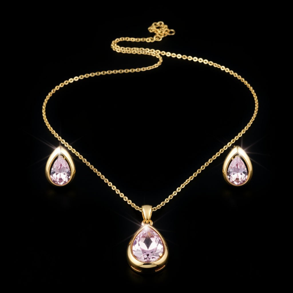 SVORA gold tone necklace and earrings set with blush pear-cut crystals. Minimalist jewelry.