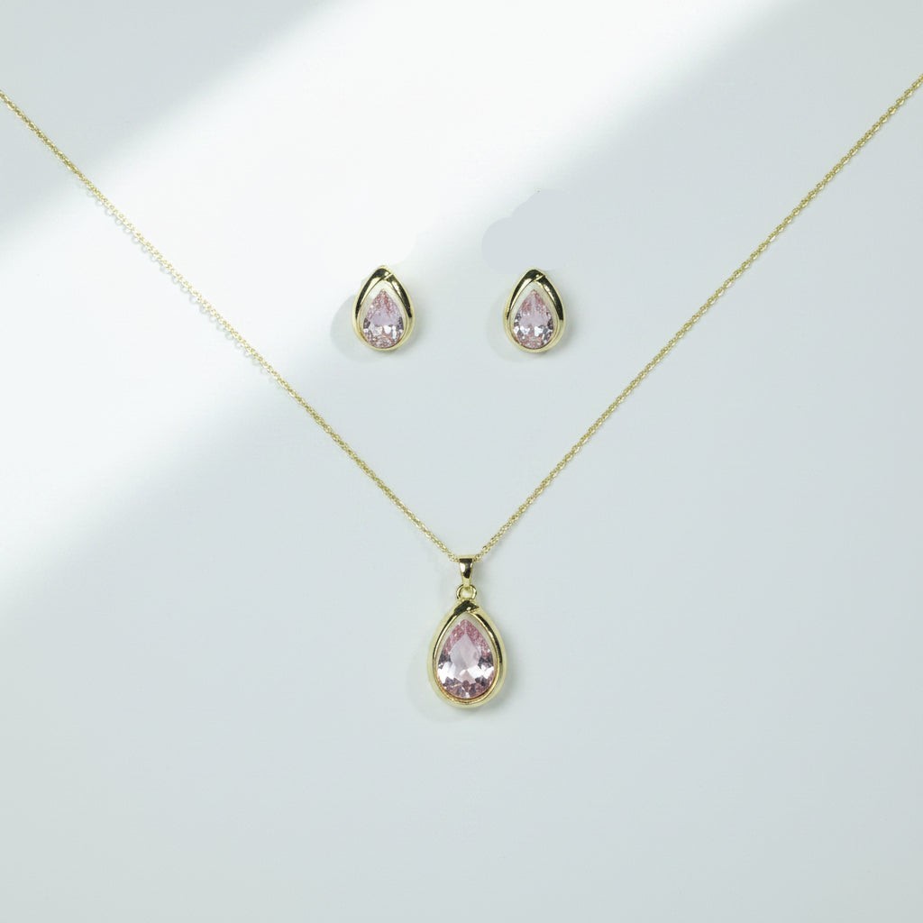 SVORA blush pear-cut crystal pendant necklace and matching stud earrings set in gold-tone stainless steel.