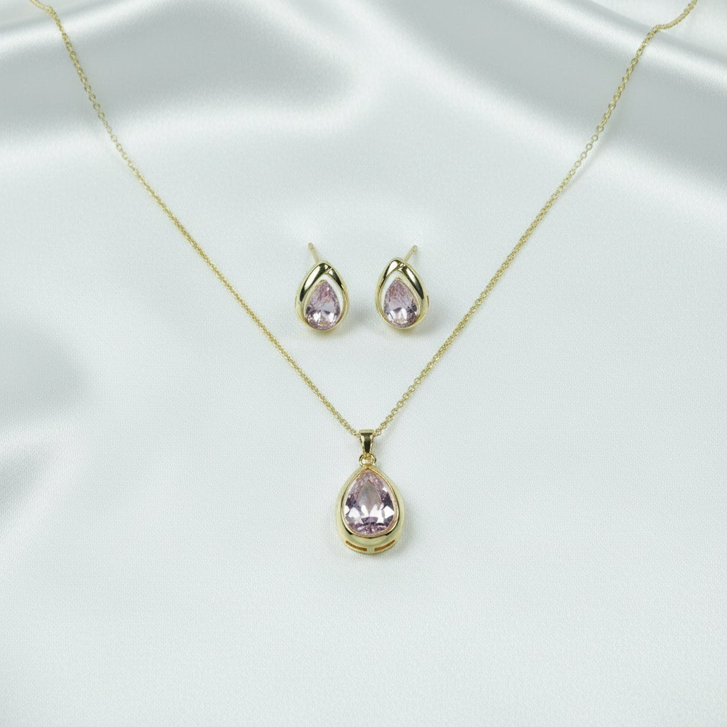 SVORA blush pear-cut crystal pendant necklace and matching stud earrings set in gold-tone stainless steel.