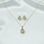 SVORA blush pear-cut crystal pendant necklace and matching stud earrings set in gold-tone stainless steel.