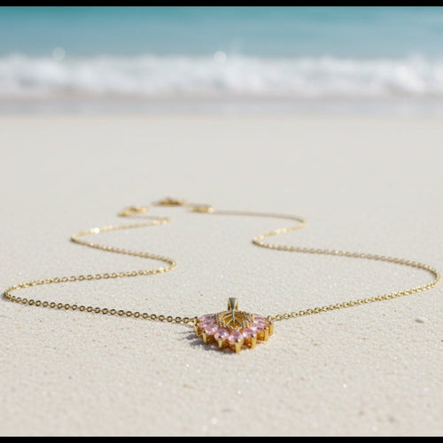 SVORA gold chain necklace with a blush pink marquise leaf pendant adorned with white CZ stones.