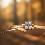 SVORA Ethereal Botanica Solitaire Ring with princess-cut clear stone and leaf filigree band on a leaf.