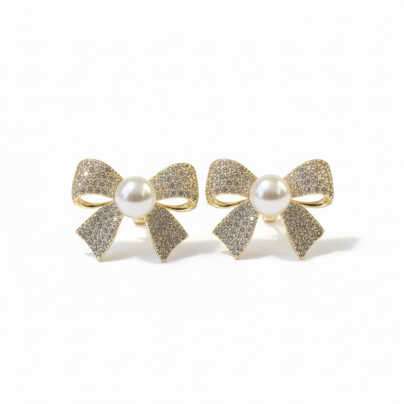 SVORA gold-tone bow stud earrings with pearl center and pavé crystal details