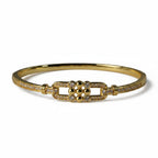 SVORA gold-plated stainless steel bangle bracelet with buckle detail and CZ stones. Waterproof and anti-tarnish.
