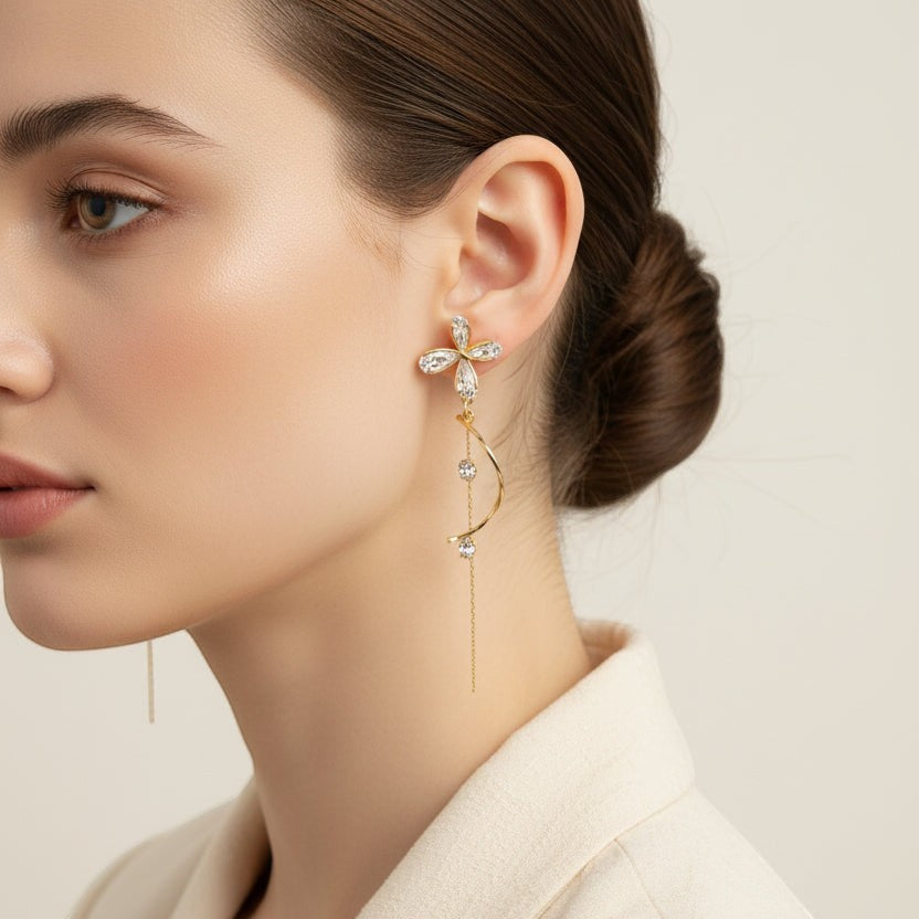 SVORA gold tone stainless steel dangle earrings with cubic zirconia butterfly and dual chains.