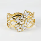 SVORA gold-plated stainless steel bracelet with mother-of-pearl butterflies and wave-edged band.