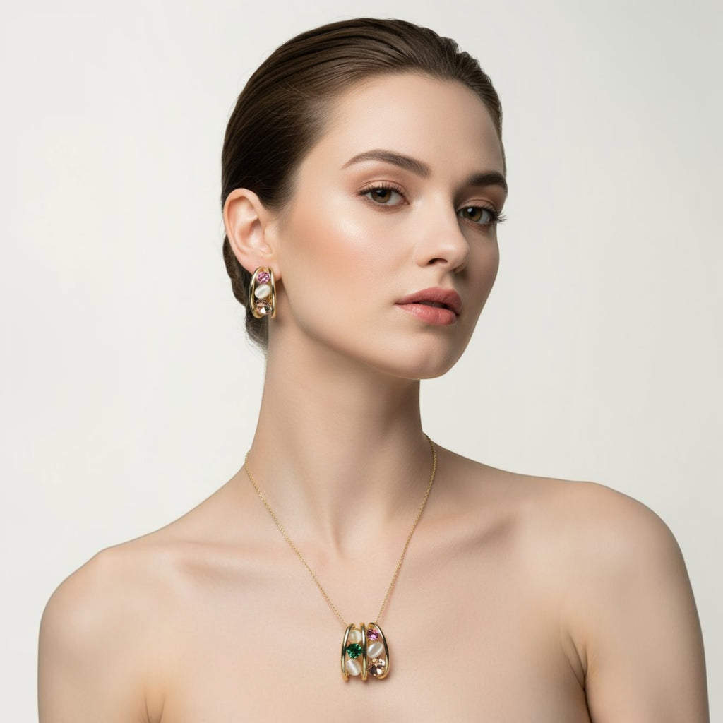 SVORA gold tone necklace and earrings set with pink, green, and cream cabochon stones in a caged design.