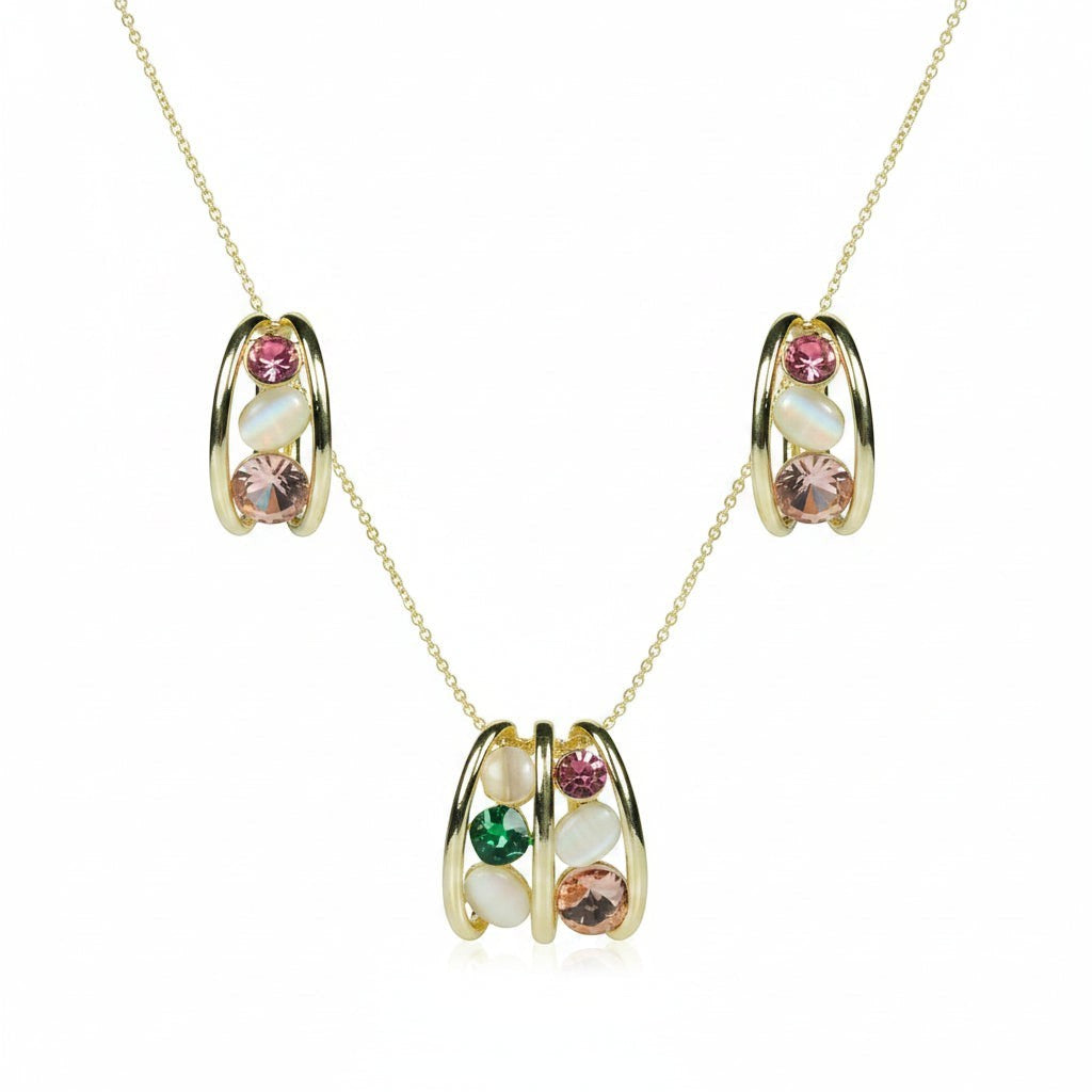SVORA gold tone necklace and earrings set with pink, green, and cream cabochon stones in a cage design.