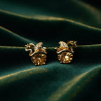 SVORA gold apple stud earrings with champagne crystals and small diamond accents.