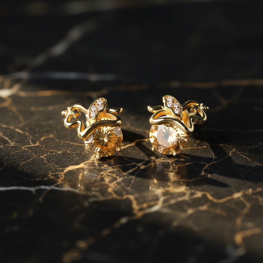 SVORA gold apple stud earrings with champagne crystals and small diamond accents.