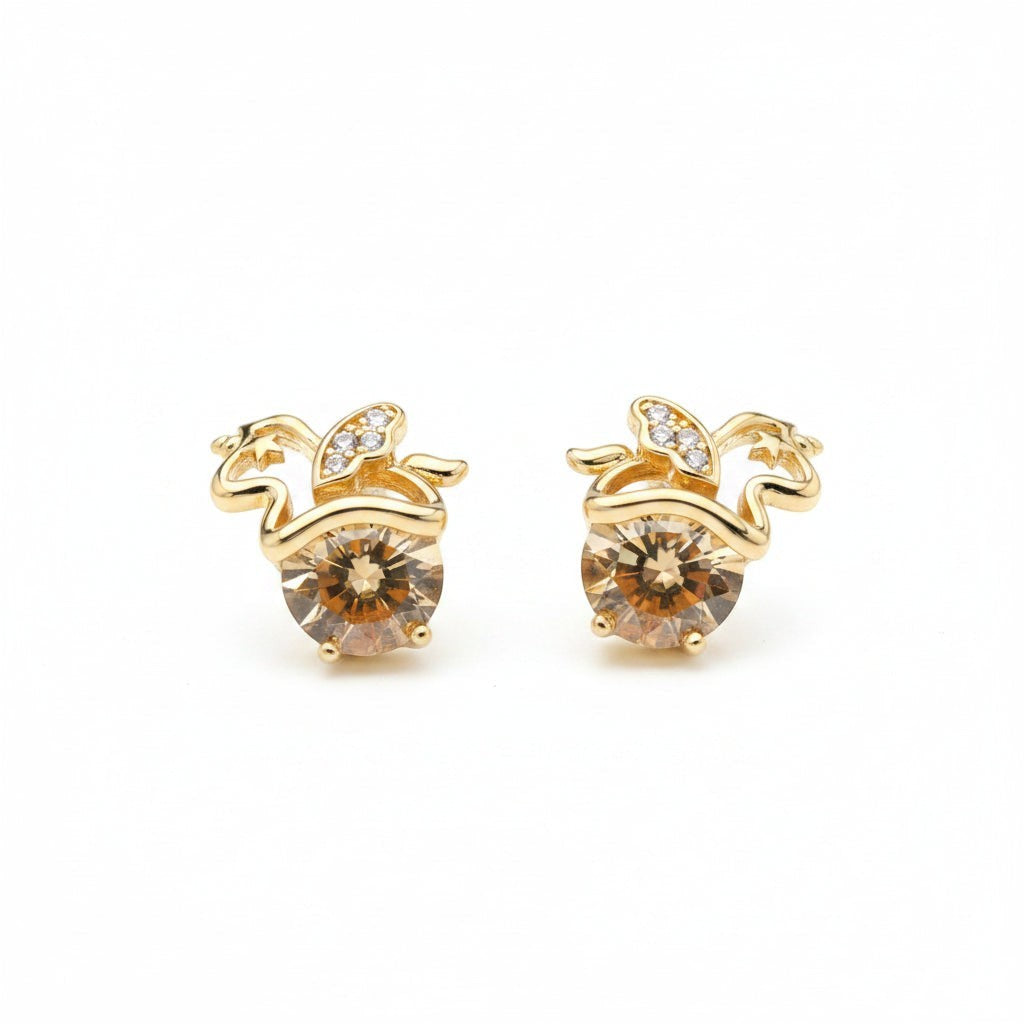 SVORA gold tone apple stud earrings with champagne crystals and small diamond accents.