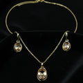SVORA oval champagne crystal necklace and earrings set with gold-tone plating and polished finish.