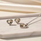 SVORA champagne crystal heart necklace and earrings set with silver bezels and chain. Free-form faceted stones.