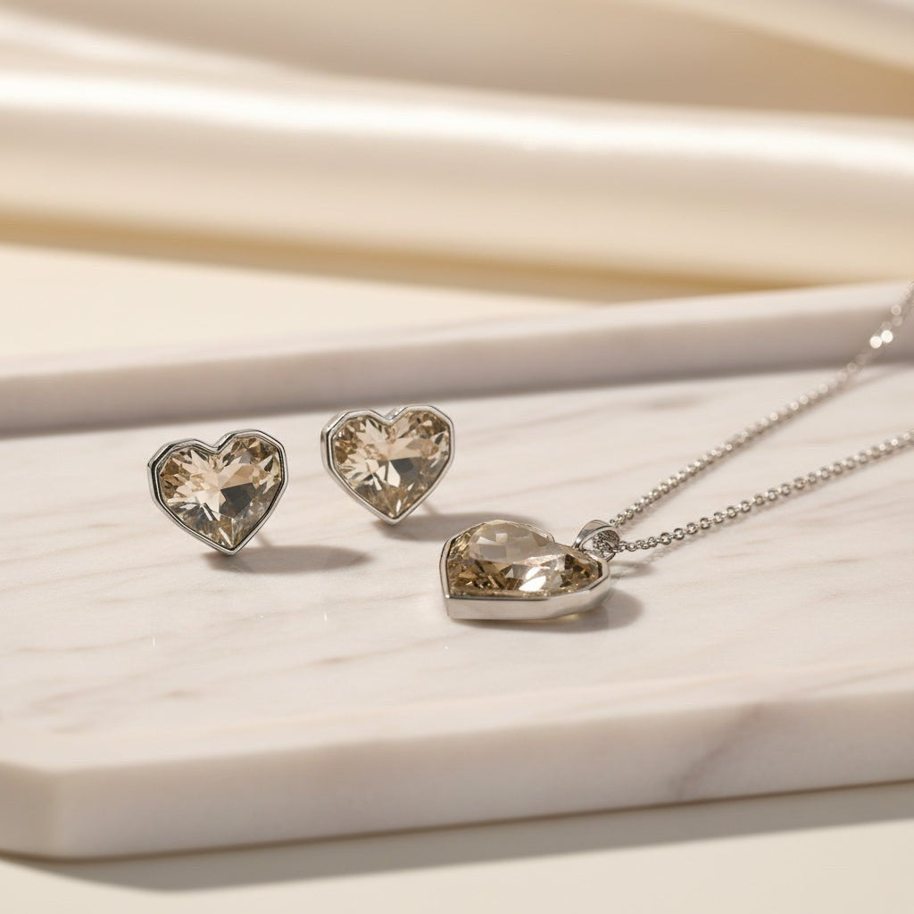SVORA champagne crystal heart necklace and earrings set with silver bezels and chain. Free-form faceted stones.