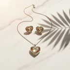 SVORA champagne crystal heart necklace and earrings set with silver bezels and chain. High polish finish.