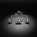 SVORA champagne crystal heart necklace and earrings set with silver bezels and chain. High polish finish.