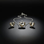 SVORA champagne crystal heart necklace and earrings set with silver bezels and chain. High polish finish.