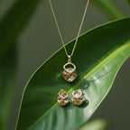SVORA gold tone necklace and earrings set with champagne crystal pendants and cubic zirconia accents.