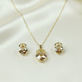 SVORA champagne nugget necklace and earrings set with faceted crystals and cubic zirconia accents, 18K gold tone.