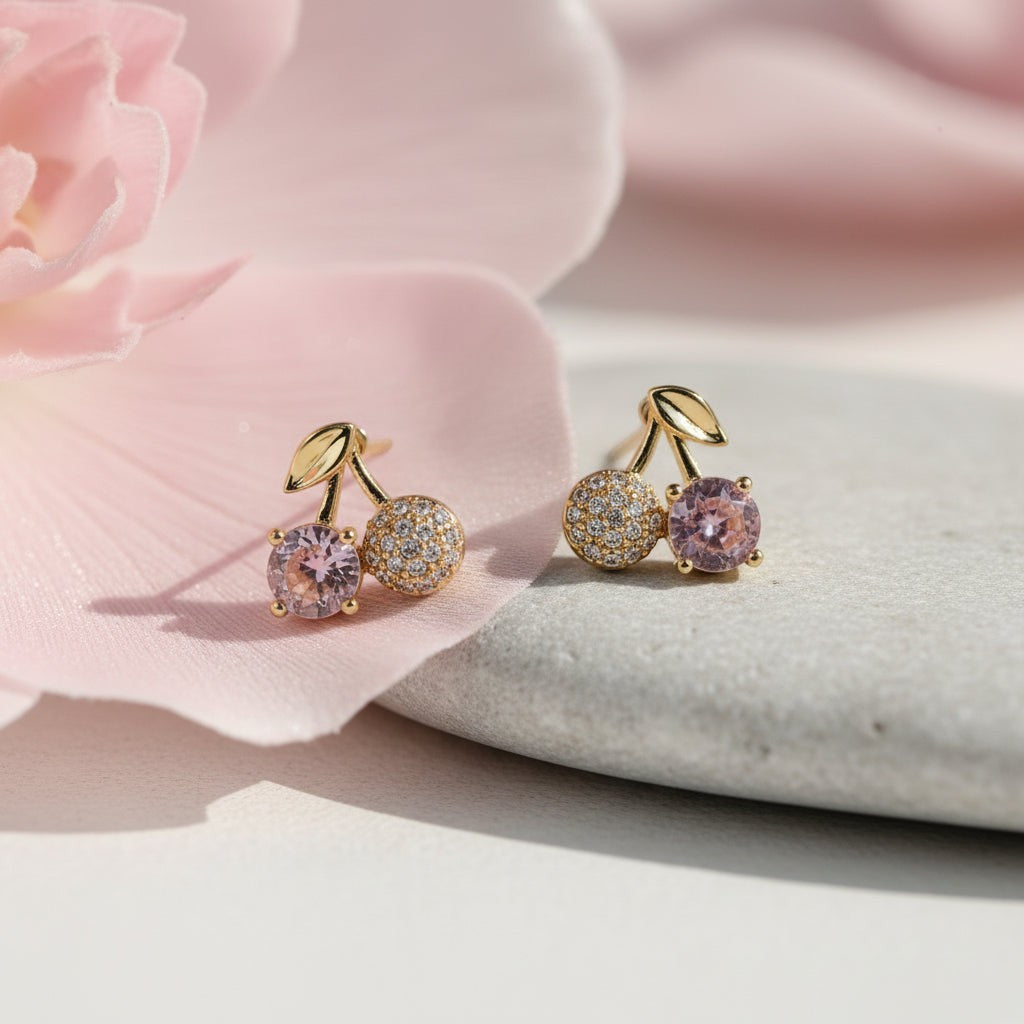 SVORA gold leaf cherry stud earrings with pink and clear cubic zirconia stones.