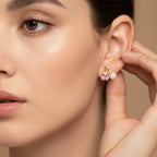 SVORA gold leaf stud earrings with pink crystal and pavé cherry charms.