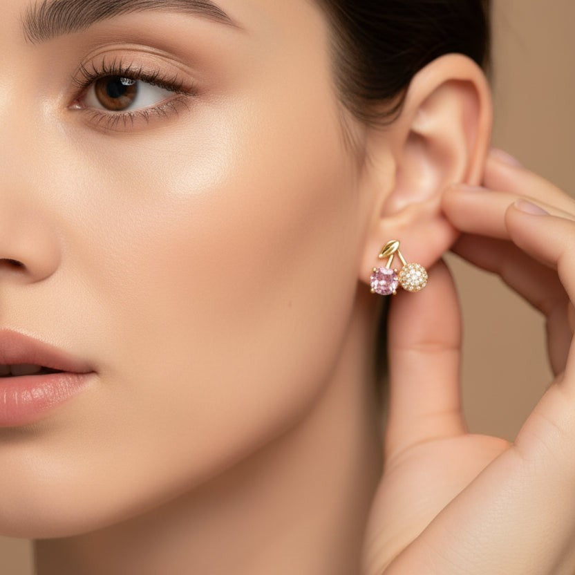 SVORA gold leaf stud earrings with pink crystal and pavé cherry charms.