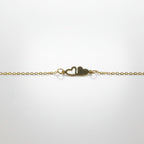 SVORA gold plated stainless steel chain bracelet with two connected hearts, one solid and one open.