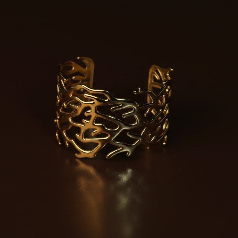 SVORA gold plated 18K stainless steel cuff bracelet with coral branch design. Openwork, adjustable, hypoallergenic.