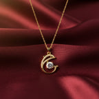 SVORA gold plated stainless steel necklace with a pavé crystal dolphin pendant holding a large white CZ.