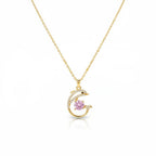 SVORA gold plated stainless steel necklace with a pavé dolphin pendant holding a pink cubic zirconia stone.