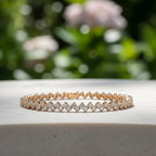 SVORA petite double tennis bracelet in gold with white CZ stones. Features two parallel rows of small CZs on a 18K gold plated stainless steel band.