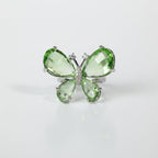 SVORA Ethereal Emerald Butterfly Ring with green pear-cut wings and pavé body on a silver band.