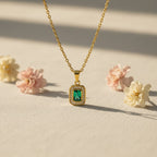 SVORA gold-plated stainless steel necklace with emerald pendant surrounded by small clear crystals. Waterproof and anti-tarnish.