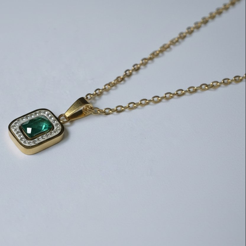 SVORA gold-plated stainless steel necklace with emerald pendant surrounded by clear crystals. Waterproof and anti-tarnish.