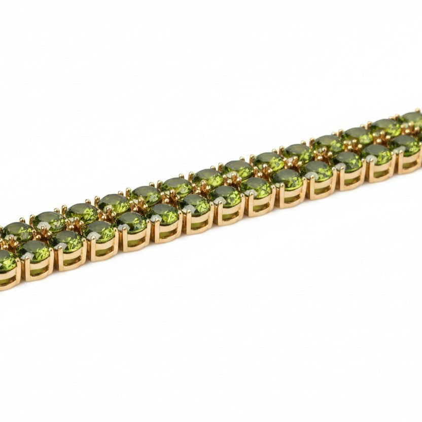 SVORA Emerald Double Row Tennis Bracelet with gold plating and prong-set green CZ stones.
